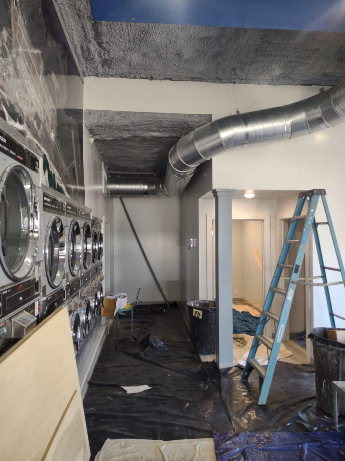 Newly installed ducts in a commercial laundry mat by Byars Service Company in Panama City